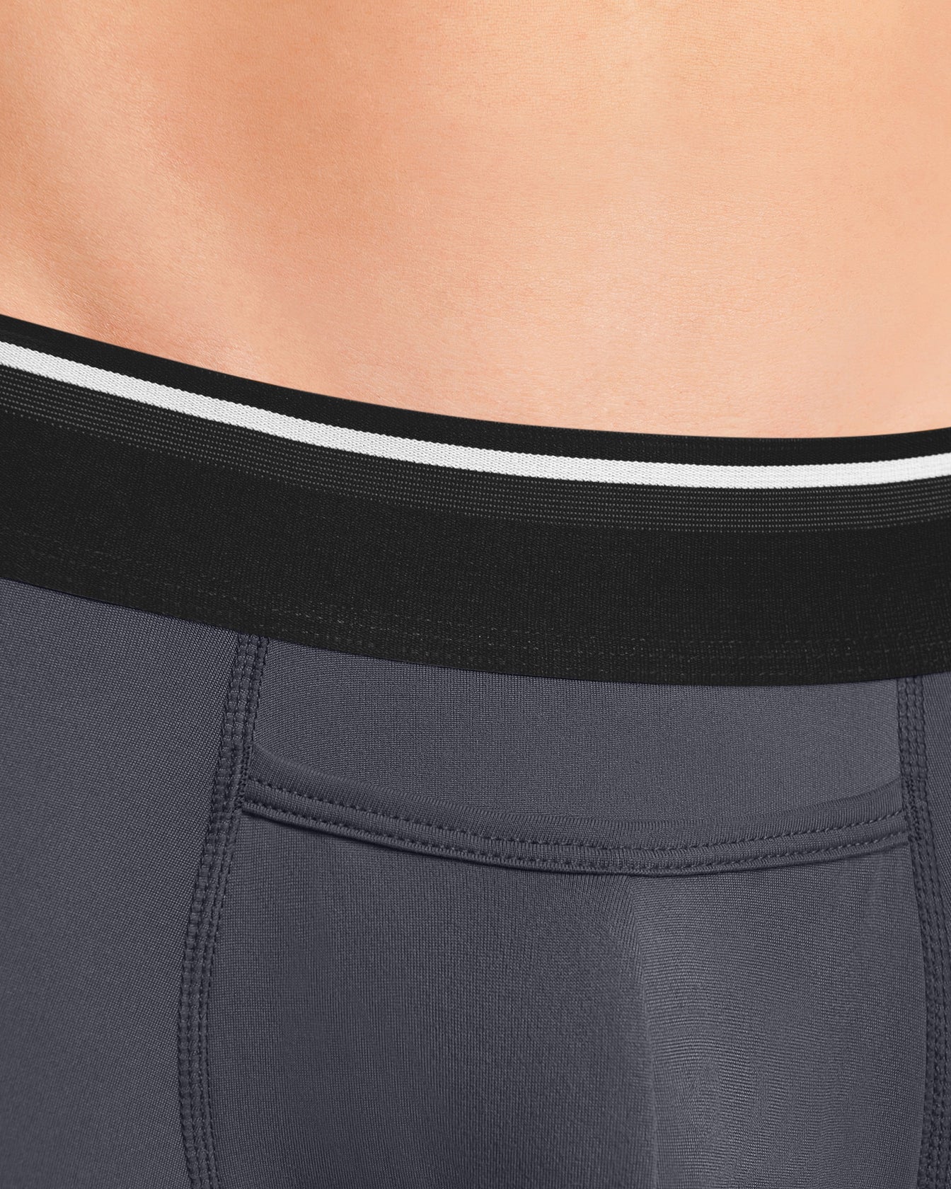 We believe that minimalism speaks volumes over loud branding. This lead us to design an understated waistband with a white and textured stripe layered on top of a classic black.
